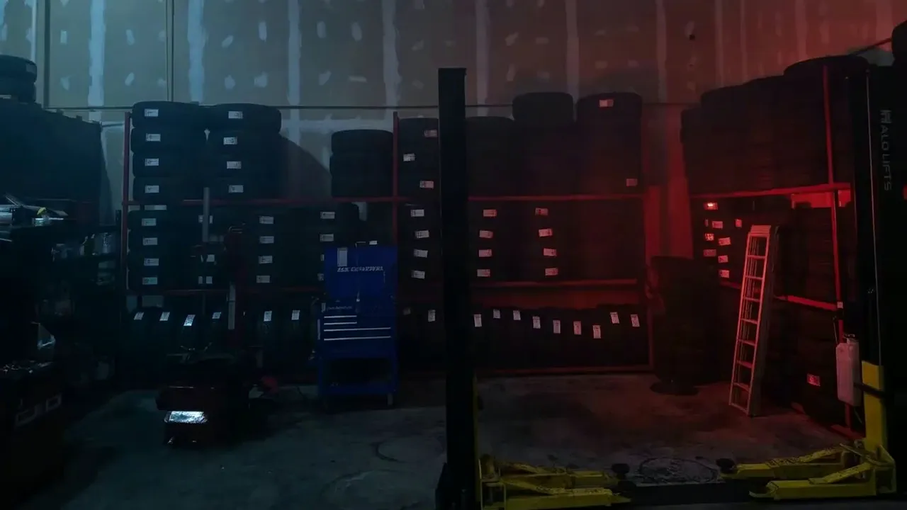 The tire racks at night under red light